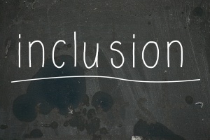 Chalk board with "inclusion" written in chalk